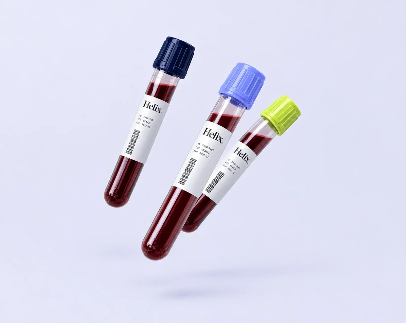 Three Helix-labelled blood collection tubes floating against a pale lavender background